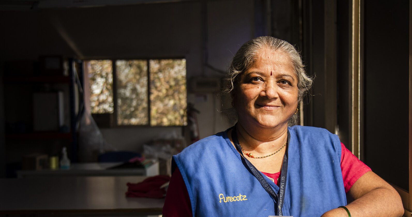 Portrait of Lata Shinde, a 57 years old lady, working in the finishing department at Purecotz Eco Lifestyles Pvt. Ltd. in Umbergaon town under Umargam district of Gujarat, India