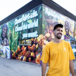 J Muzacz in front of his Fairtrade mural