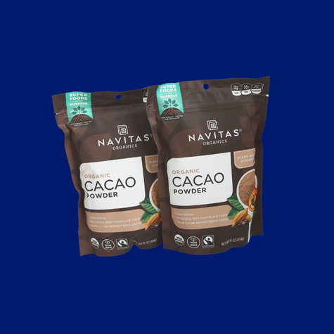 Navitas Cacao Powder on a blue background