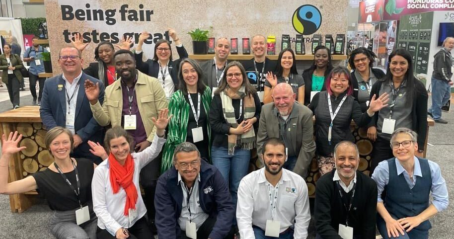 Members of Fairtrade International, Fairtrade Canada, Fairtrade Africa, CLAC, Fairtrade America and Flocert in a group photo at Specialty Coffee Association Expo in Portland in April, 2023